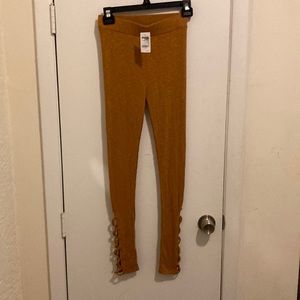 Knit leggings with designer crisscross design on the bottom of legs